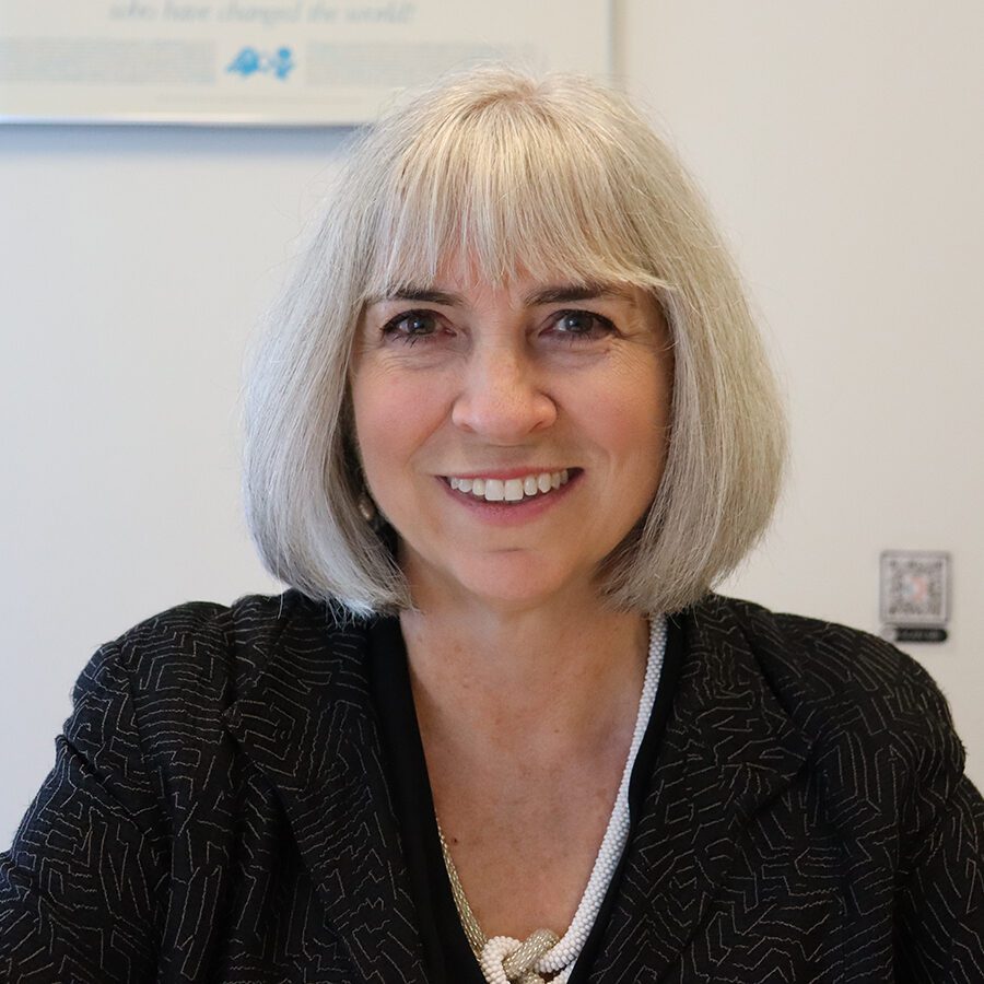 Woman sitting and smiling