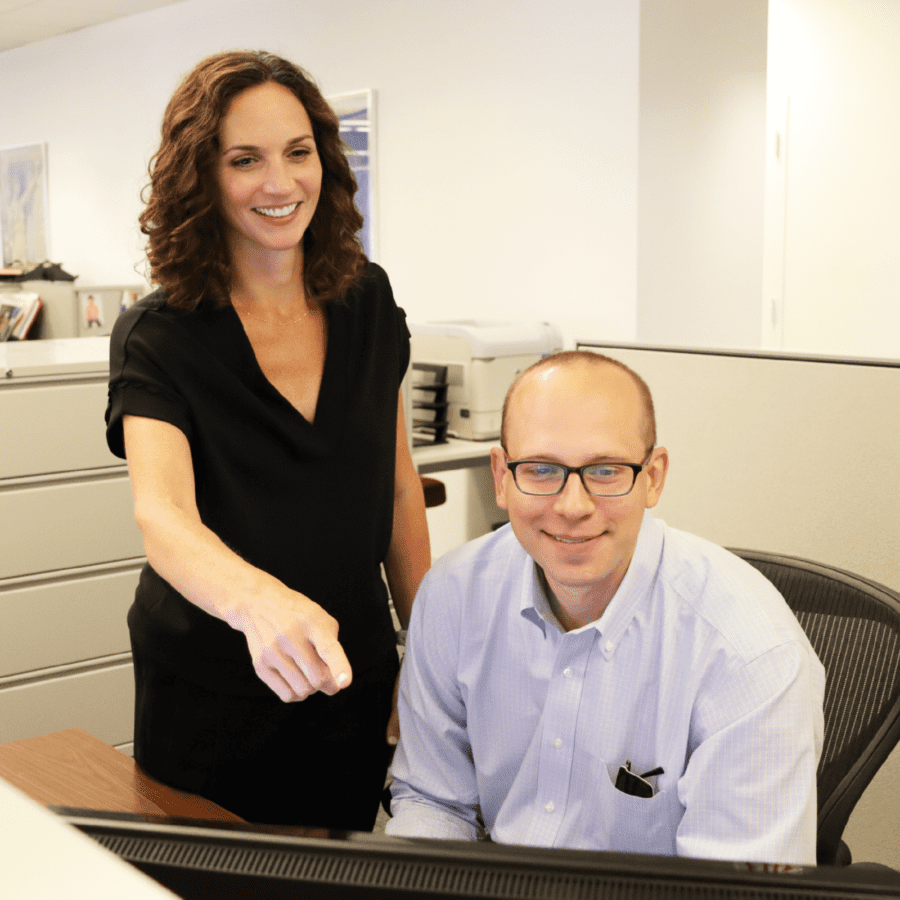 Coworkers conducting computer research